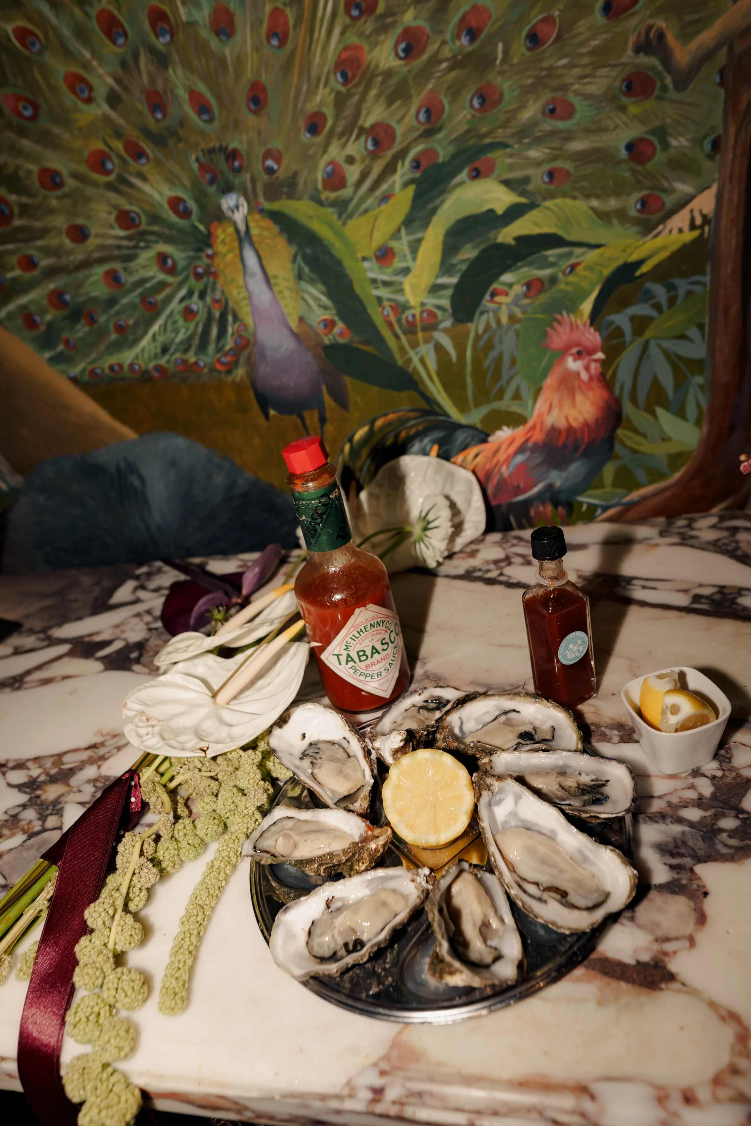 SS Port Lympne Safari Park New Orleans Wedding Editorial The Chamberlins Film Medium Format Photography London Surrey 728 - Wedding Inspiration That Celebrates The Joy, Diversity & Vibrancy of New Orleans Oysters on a plate with lemon and Tabasco sauce.
