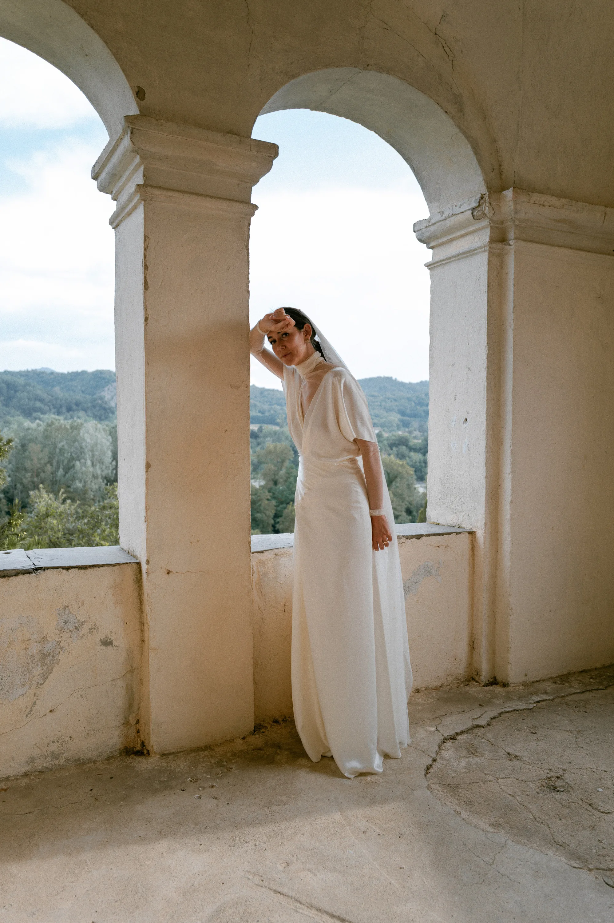 Bride wearing a Cortana wedding dress and veil with tiny embroidered stars.