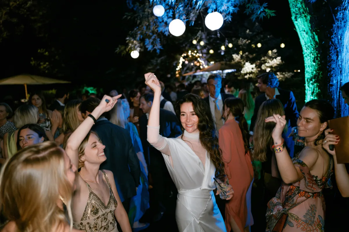 Bride wearing Cortana dancing with her guests at her wedding reception.