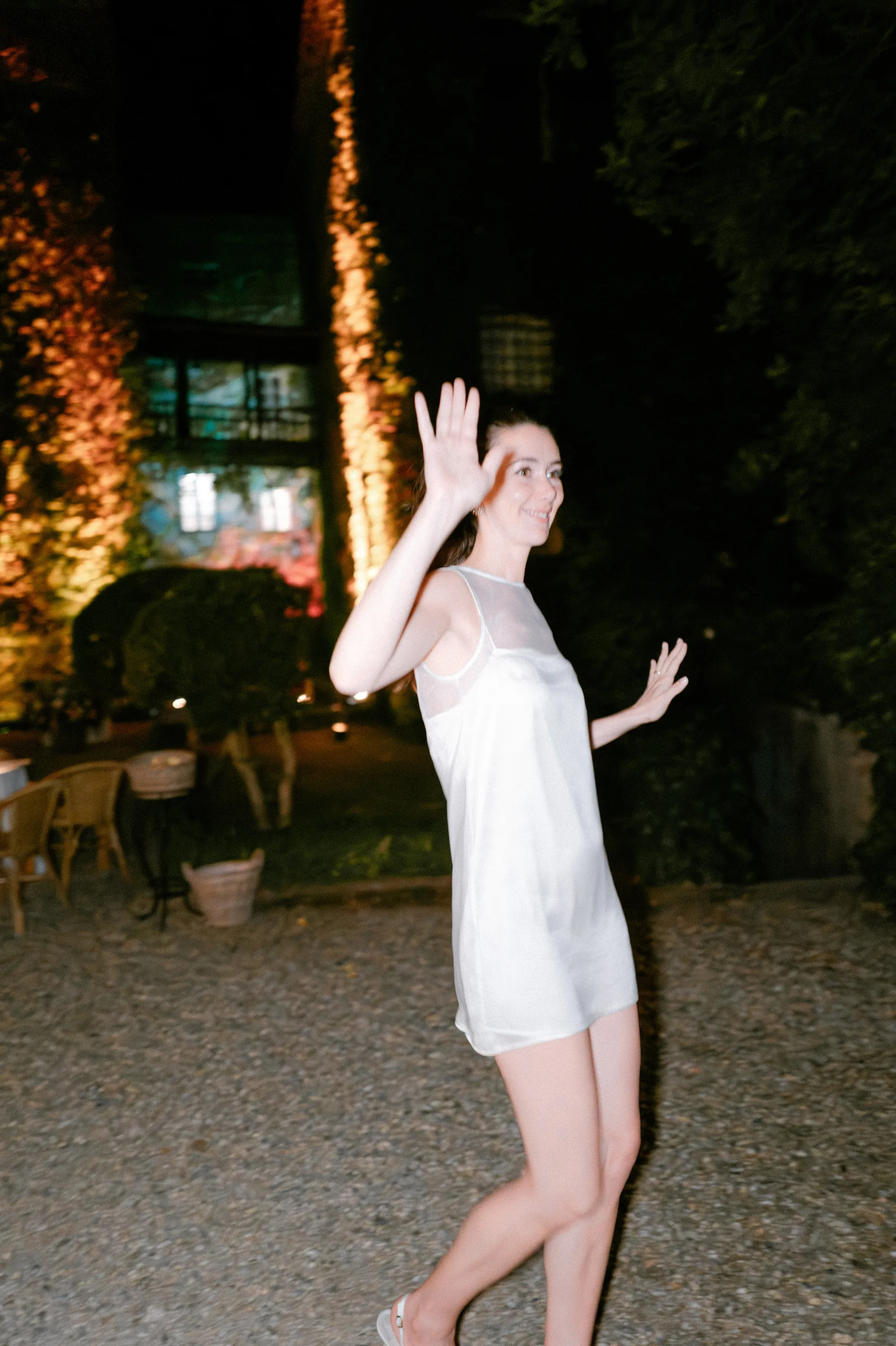 Bride in a mini dress on the evening of her private Italian villa wedding.