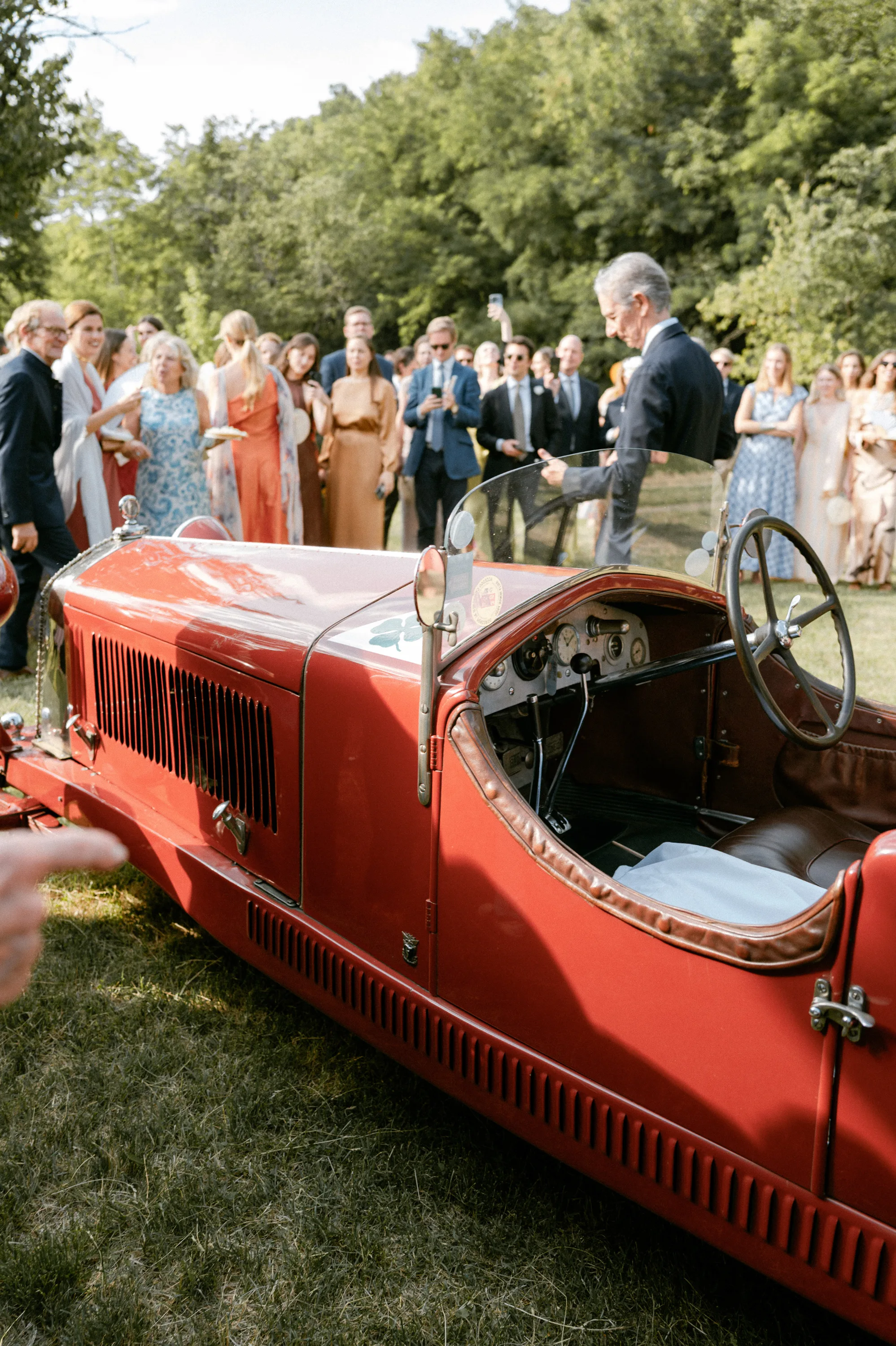 Vintage red car on a wedding day.