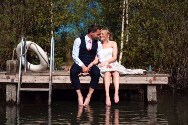 Lakeside wedding ceremony couple paddling with Everlong Ceremonies