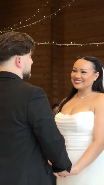 Luxury UK wedding couple walking through countryside venue at golden hour, natural candid wedding content by DuoVision