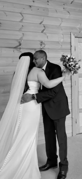 Luxury UK wedding couple walking through countryside venue at golden hour, natural candid wedding content by DuoVision