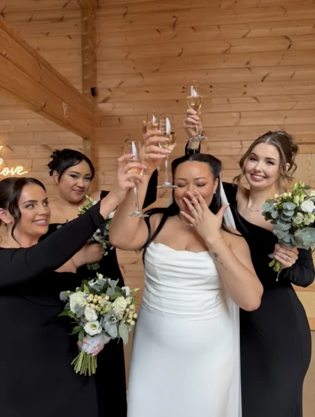 Luxury UK wedding couple walking through countryside venue at golden hour, natural candid wedding content by DuoVision