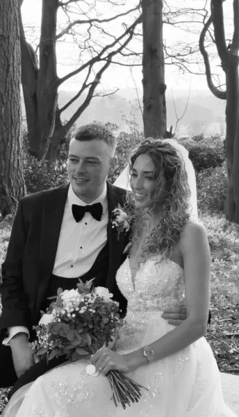 Luxury UK wedding couple walking through countryside venue at golden hour, natural candid wedding content by DuoVision