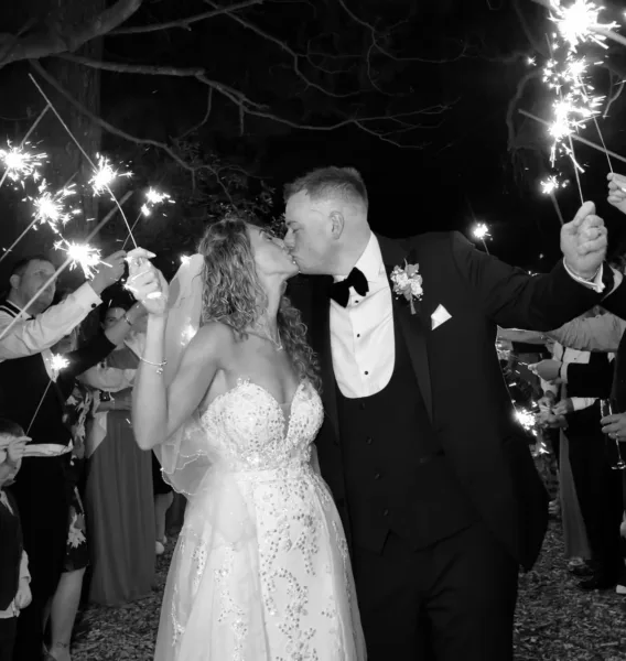 Luxury UK wedding couple walking through countryside venue at golden hour, natural candid wedding content by DuoVision