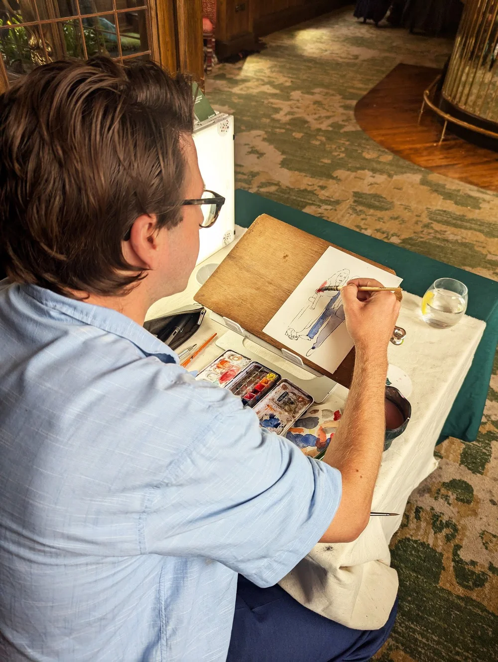 Peter Kuznicki of Kuznicki live, a live wedding artist and illustrator creating live watercolour paintings of wedding guests