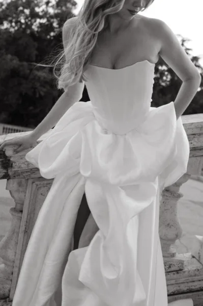 Bride wearing a dramatic ruffled white gown outdoors at a Villa Borghese wedding in Rome styled by Zahra Studio Events