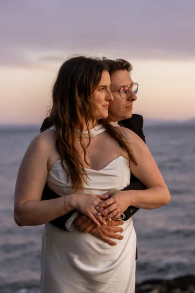 Bride and groom at blue hour with beautiful lighting on their faces