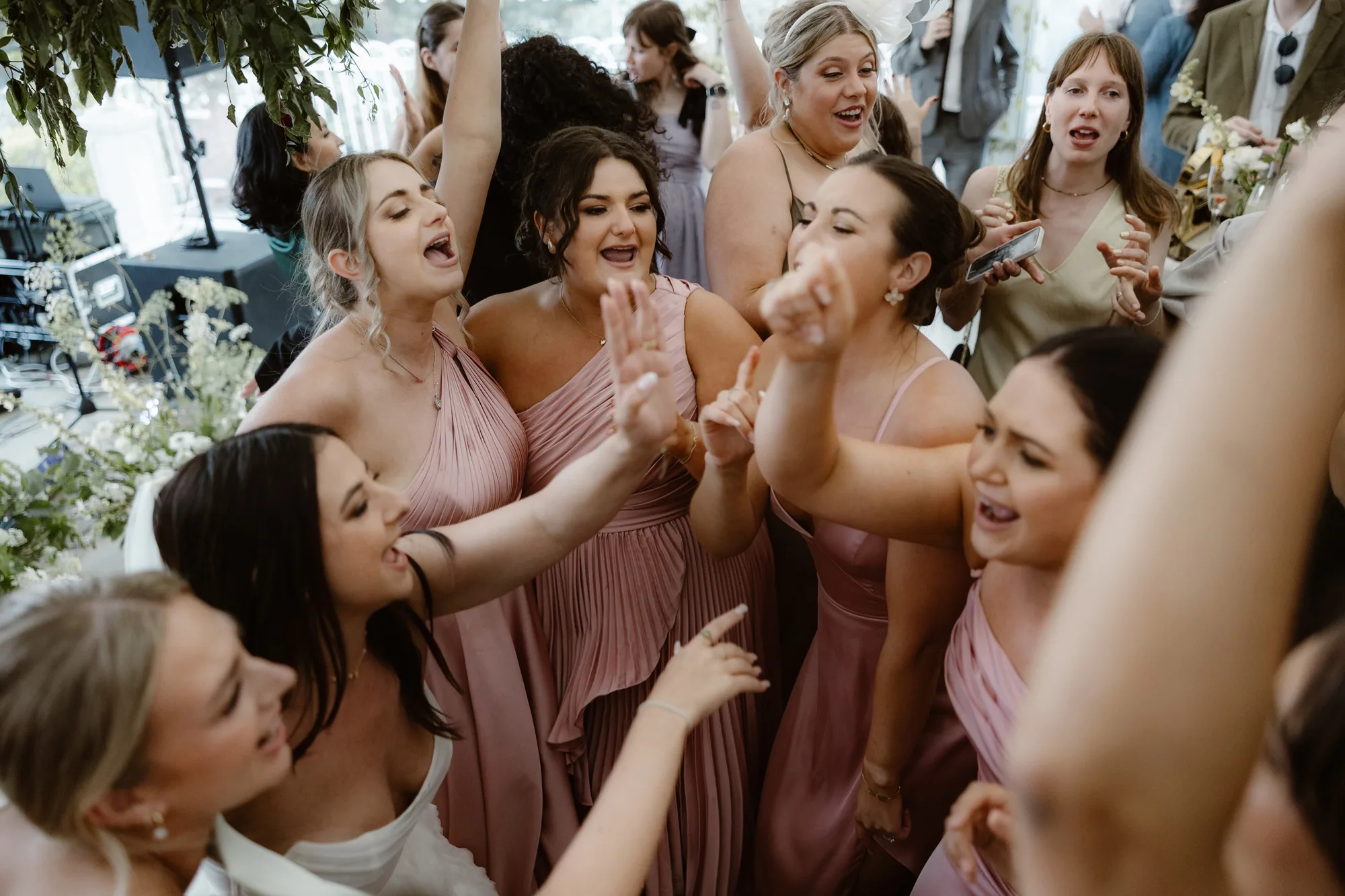 Capesthorne Hall Summer Wedding Jessica Sharpe Wedding Planner Jono Symonds Love My Dress.145 - Sophie & Dimitri's Beautiful, Relaxed & Elegant Wedding Weekend at Capesthorne Hall in Cheshire Bridesmaids in pink dresses singing and dancing together on the dance floor.