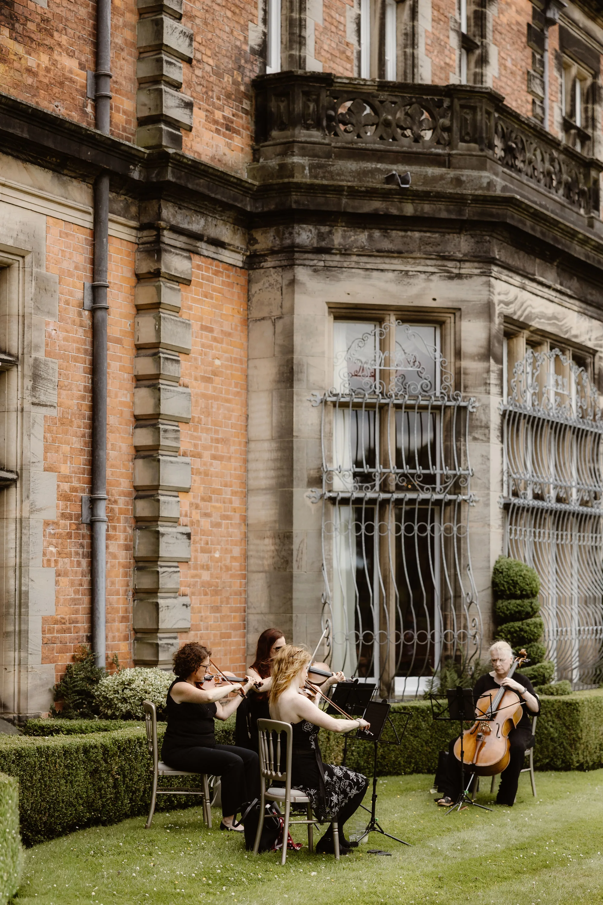 Capesthorne Hall Summer Wedding Jessica Sharpe Wedding Planner Jono Symonds Love My Dress.47 - Sophie & Dimitri's Beautiful, Relaxed & Elegant Wedding Weekend at Capesthorne Hall in Cheshire String quartet perform in the gardens at Capesthorne Hall in Cheshire on a wedding day.