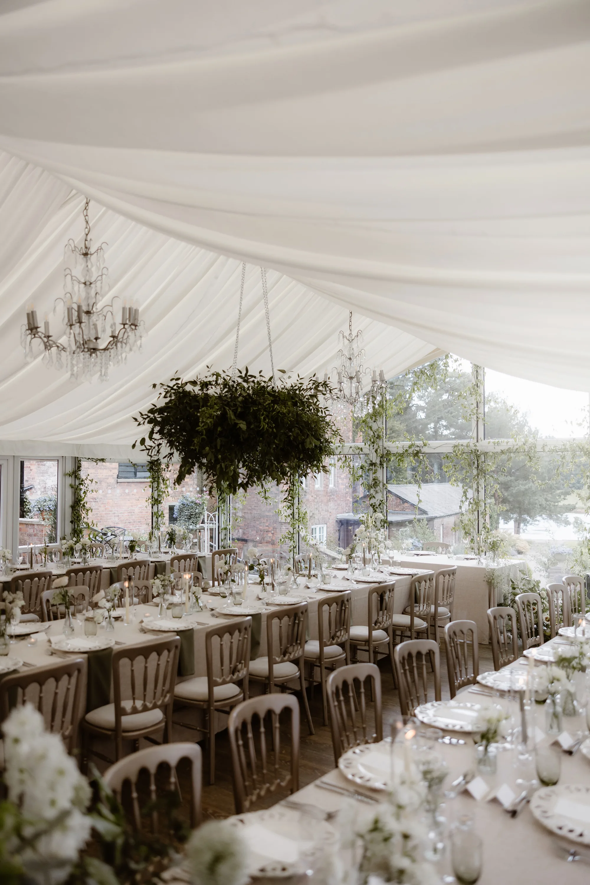 Capesthorne Hall Summer Wedding Jessica Sharpe Wedding Planner Jono Symonds Love My Dress.60 - Sophie & Dimitri's Beautiful, Relaxed & Elegant Wedding Weekend at Capesthorne Hall in Cheshire Foliage installation of green hanging above the tables at Capesthorne Hall wedding venue reception setting.