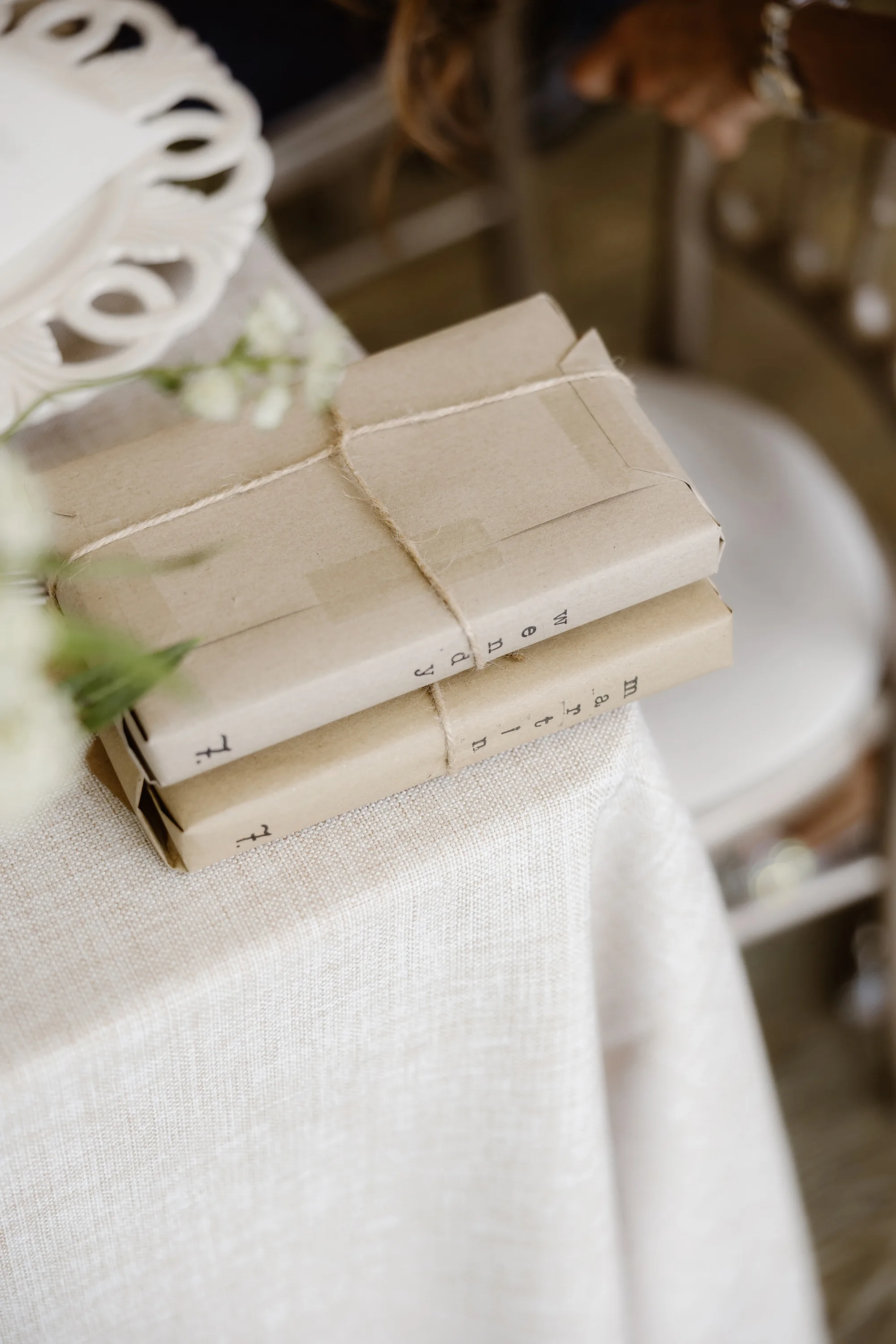Capesthorne Hall Summer Wedding Jessica Sharpe Wedding Planner Jono Symonds Love My Dress.62 - Sophie & Dimitri's Beautiful, Relaxed & Elegant Wedding Weekend at Capesthorne Hall in Cheshire Books wrapped in paper and string as wedding favours.
