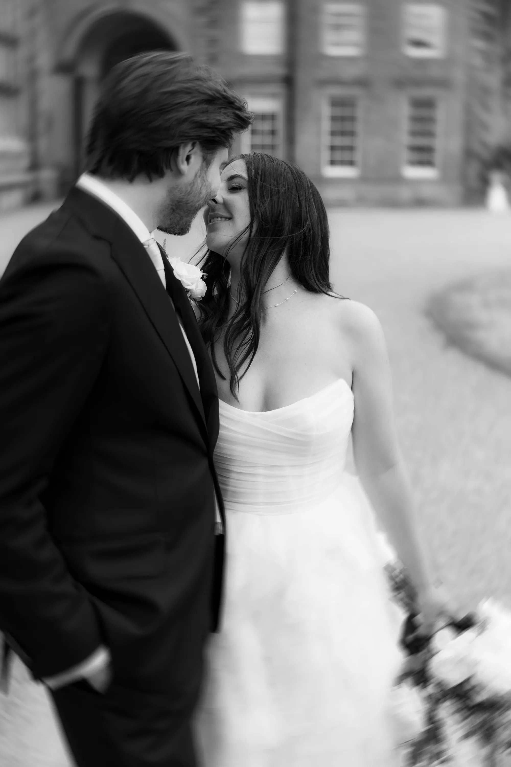 Capesthorne Hall Summer Wedding Jessica Sharpe Wedding Planner Jono Symonds Love My Dress.79 - Sophie & Dimitri's Beautiful, Relaxed & Elegant Wedding Weekend at Capesthorne Hall in Cheshire Soft and romantic portrait of a bride leaning into the neck of her groom to kiss his lips.
