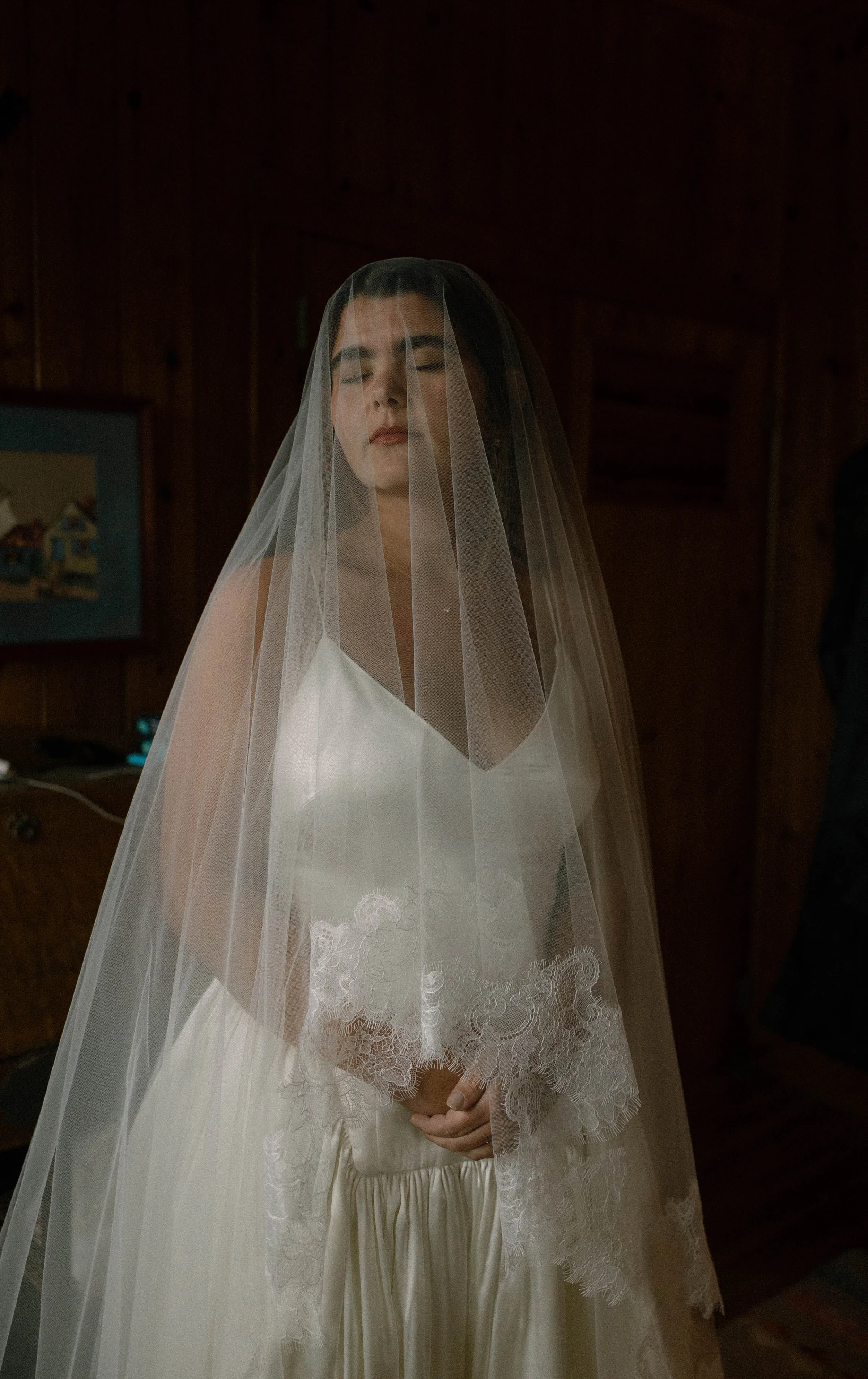 Danielle Frankel Bride Leslie DeAnne Photography.14 - Olivia in Danielle Frankel for her Intimate, Modern & Non-Traditional Wedding Intimate portrait of a bride wearing the dropped waist Nina gown by Danielle Frankel and a veil covering her face.