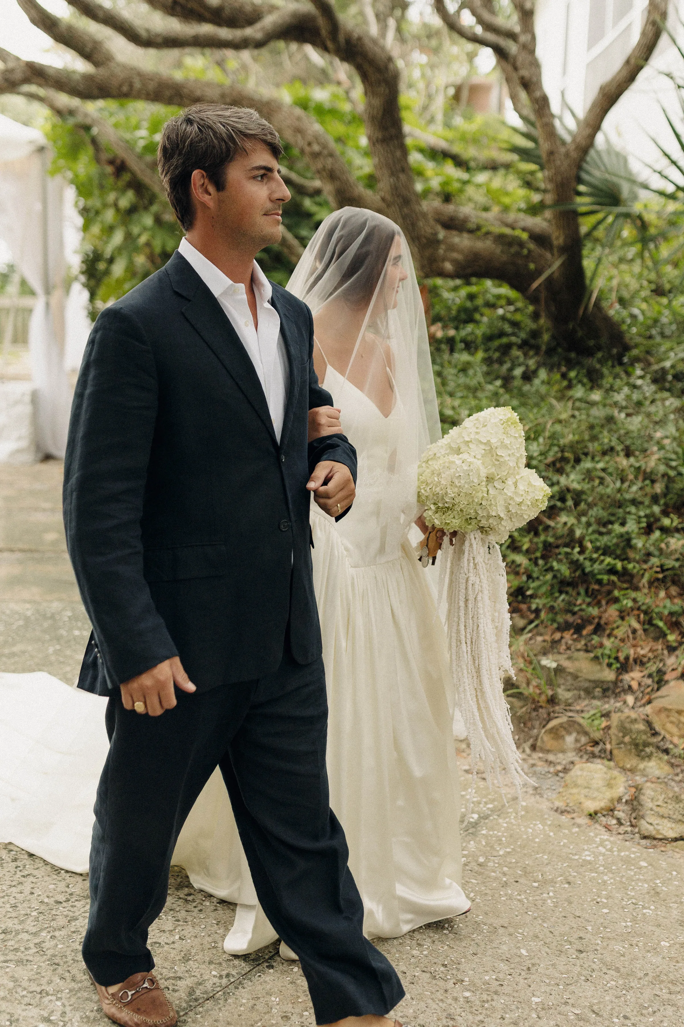Danielle Frankel Bride Leslie DeAnne Photography.39 - Olivia in Danielle Frankel for her Intimate, Modern & Non-Traditional Wedding Bride wearing the Nina gown by Danielle Frankel as she is accompanied arm in arm by her brother to the wedding ceremony