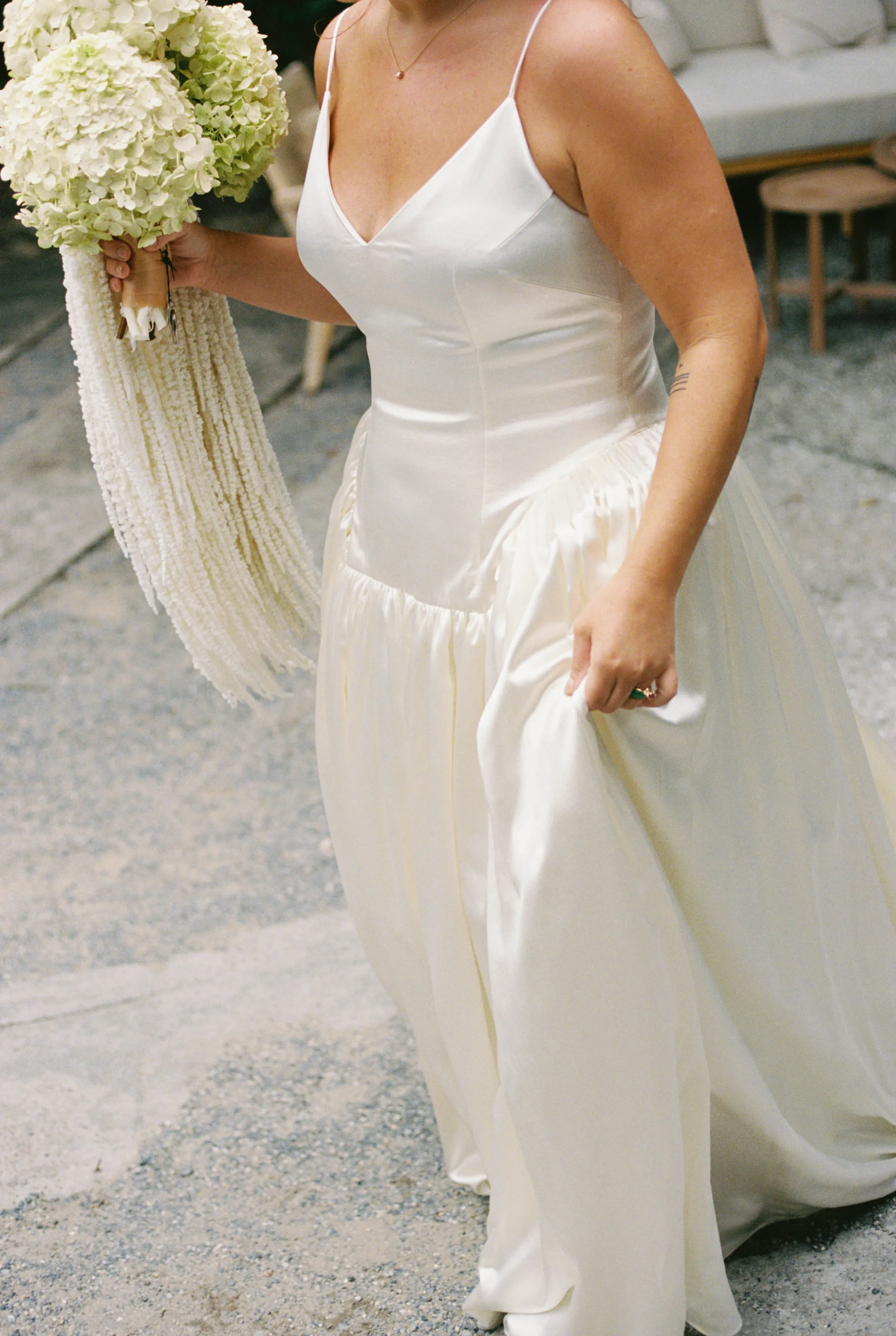Danielle Frankel Bride Leslie DeAnne Photography.74 1 - Olivia in Danielle Frankel for her Intimate, Modern & Non-Traditional Wedding Torso shot of a bride wearing a dropped waist Danielle Frankel 'Nina' wedding dress. He carries a large bouquet of white and green hydrangea