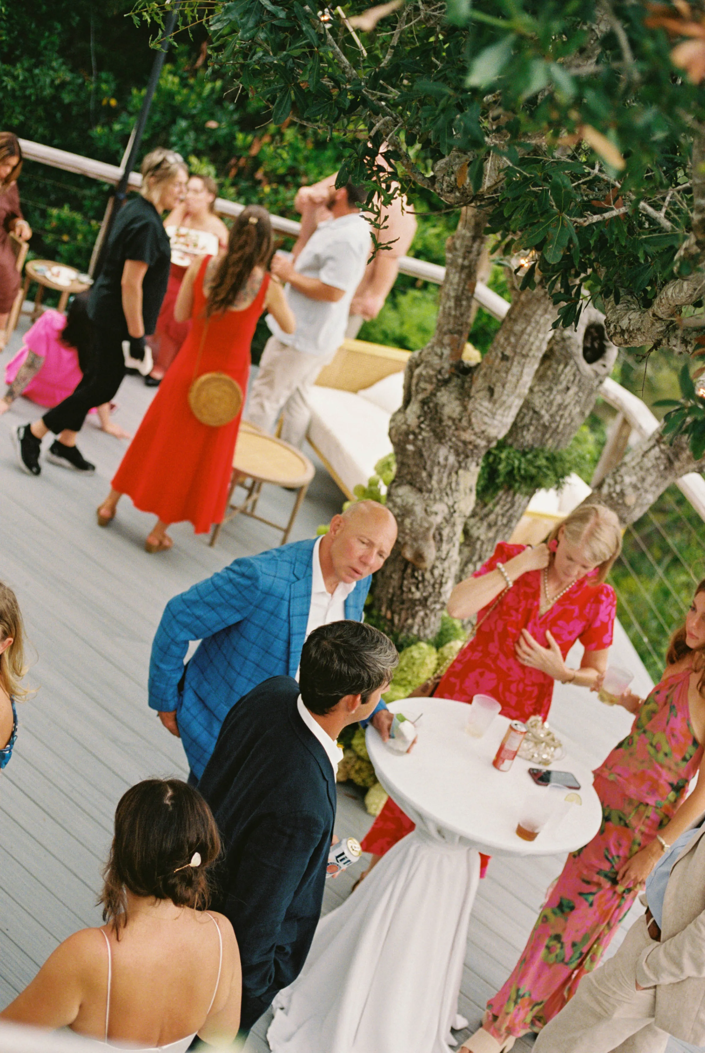 Danielle Frankel Bride Leslie DeAnne Photography.80 - Olivia in Danielle Frankel for her Intimate, Modern & Non-Traditional Wedding Guests gathering for a wedding outdoors on decking.