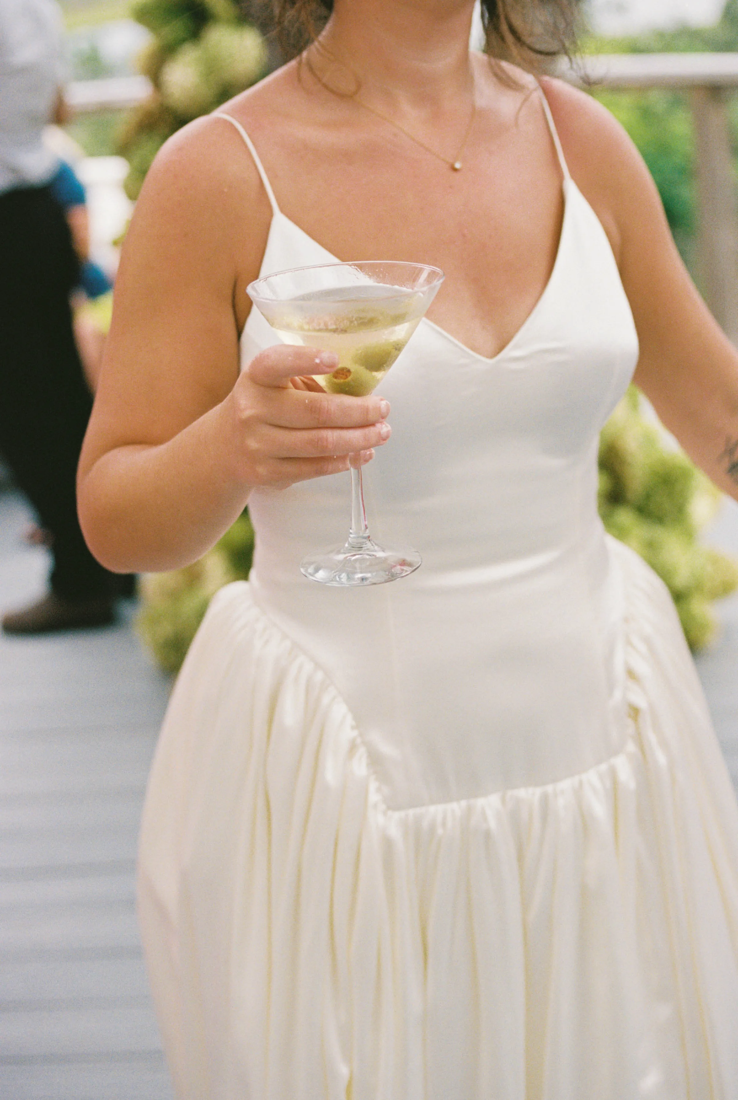 Danielle Frankel Bride Leslie DeAnne Photography.81 1 - Olivia in Danielle Frankel for her Intimate, Modern & Non-Traditional Wedding Torso shot of a bride wearing a dropped waist Danielle Frankel 'Nina' wedding dress. She carries a long stemmed glass of champagne