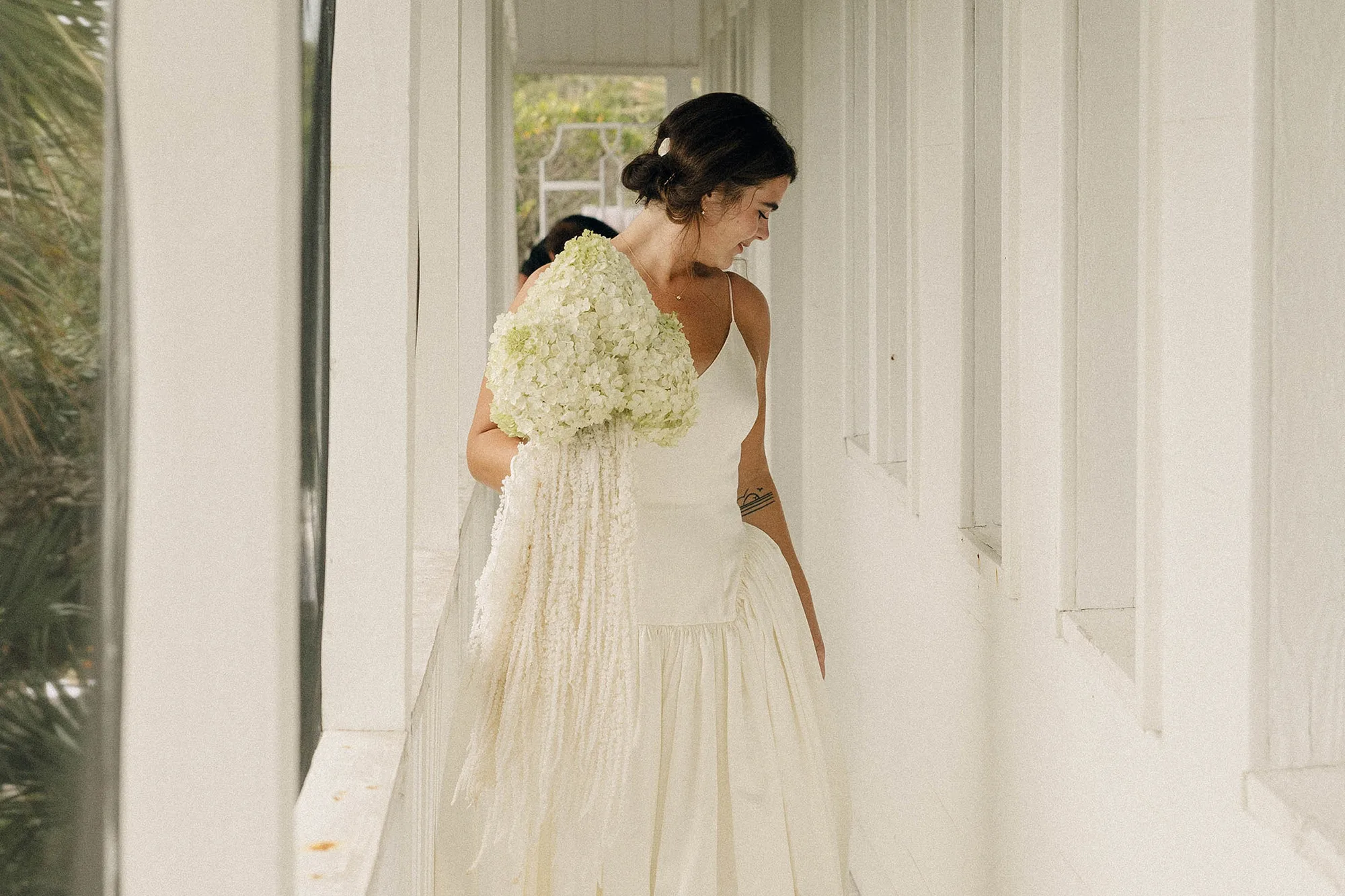 Danielle Frankel bride - Olivia in Danielle Frankel for her Intimate, Modern & Non-Traditional Wedding Danielle Frankel bride carrying a green and white hydrangea bouquet
