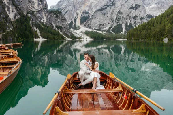 Bride and groom on Lake Braies sitting on the boat