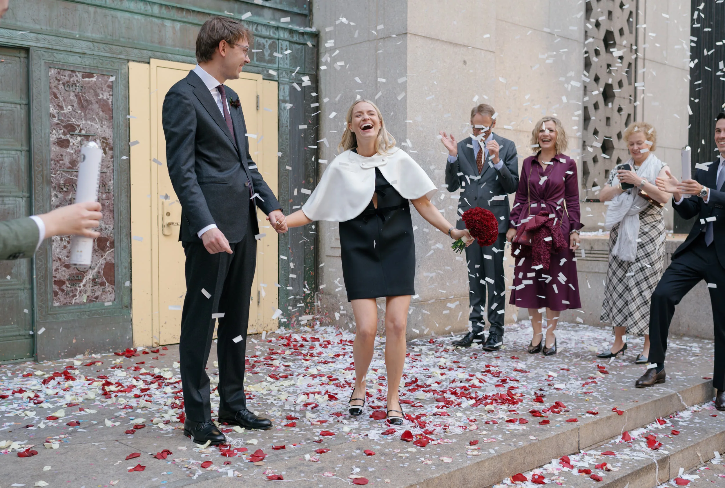 Mini black and bow Prada dress, New York City Hall wedding with petal confetti