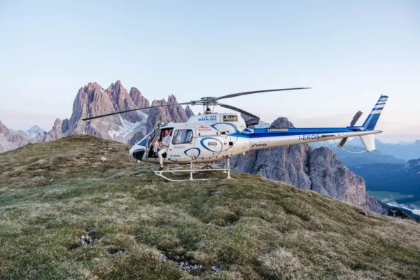 Helicopter elopement with bride and groom enjoying the views of Tre Cime