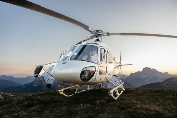 Helicopter with Bride and groom inside during their heli elopement on Cadini di Misurina