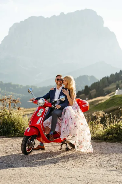 Bride and groom on Vespa at Passo Gardena