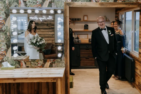 Father of the brides gets his first look at his daughter on her wedding day at The Harty Estate