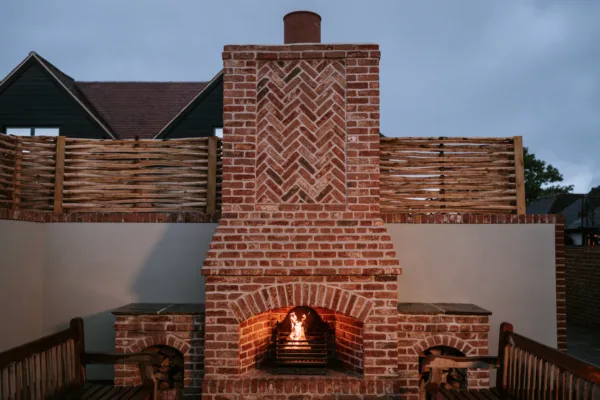 Alfresco brick fireplace and chimney at a Kent wedding venue
