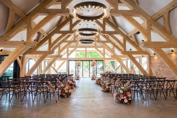 Barn venue in Kent decorated for a wedding ceremony