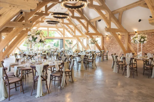 Barn venue in Kent decorated for a wedding breakfast