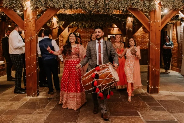 Indian bride in a red sari celebrates a cultural wedding at The Harty Estate