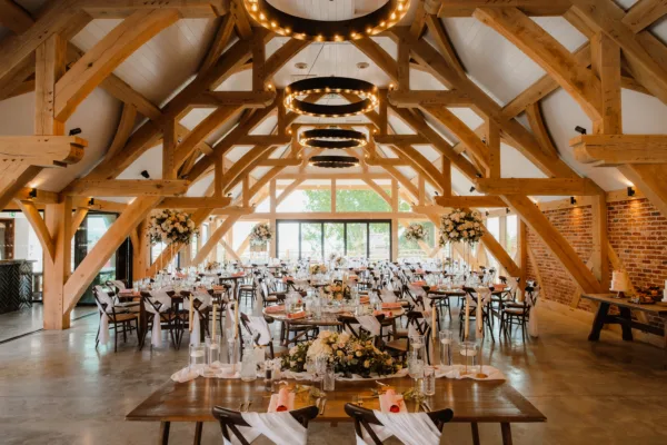 Barn venue in Kent decorated for a wedding breakfast