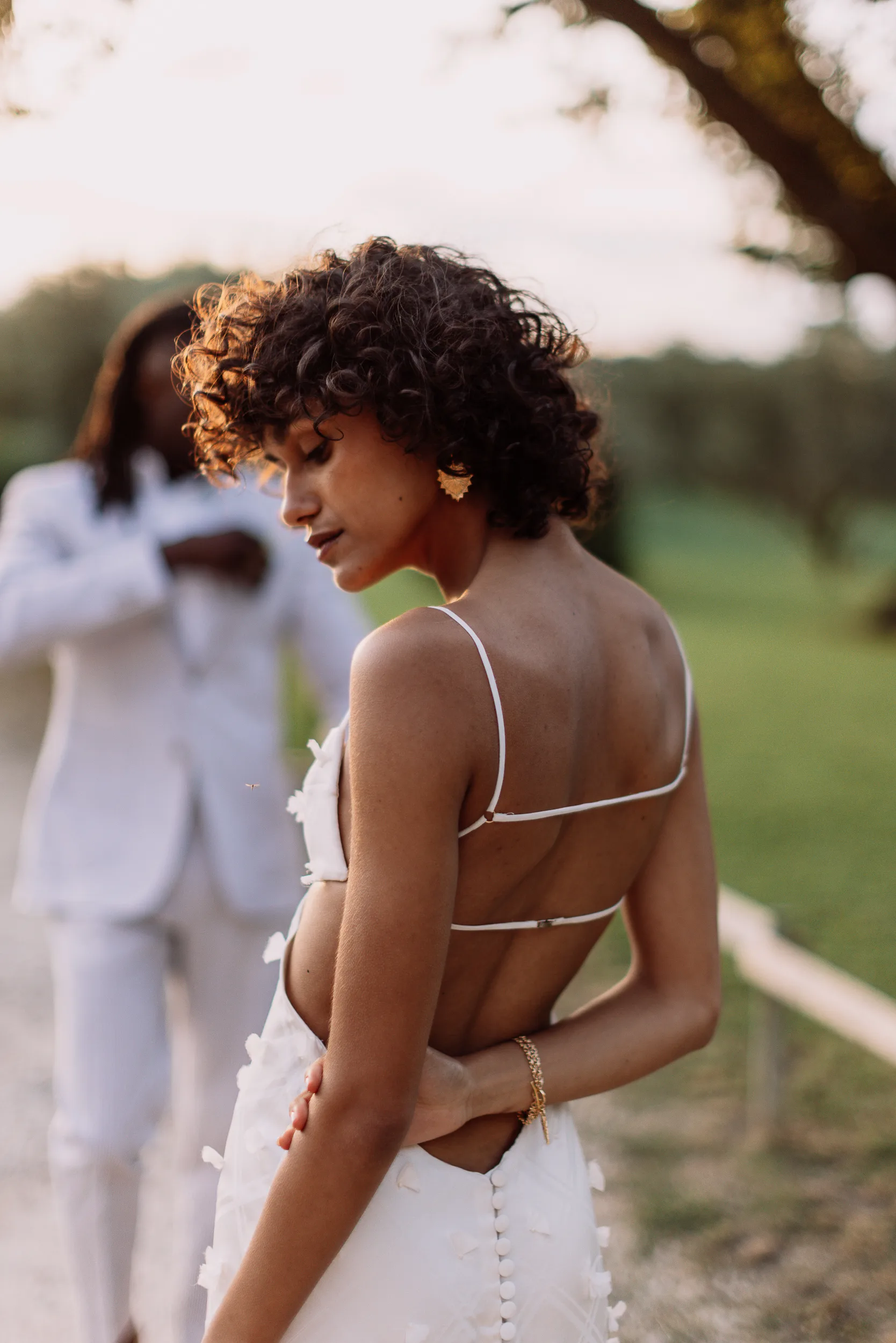 Elegant Black model bride looking stunning in a backless Maison Thérèse Chopinet wedding dress.