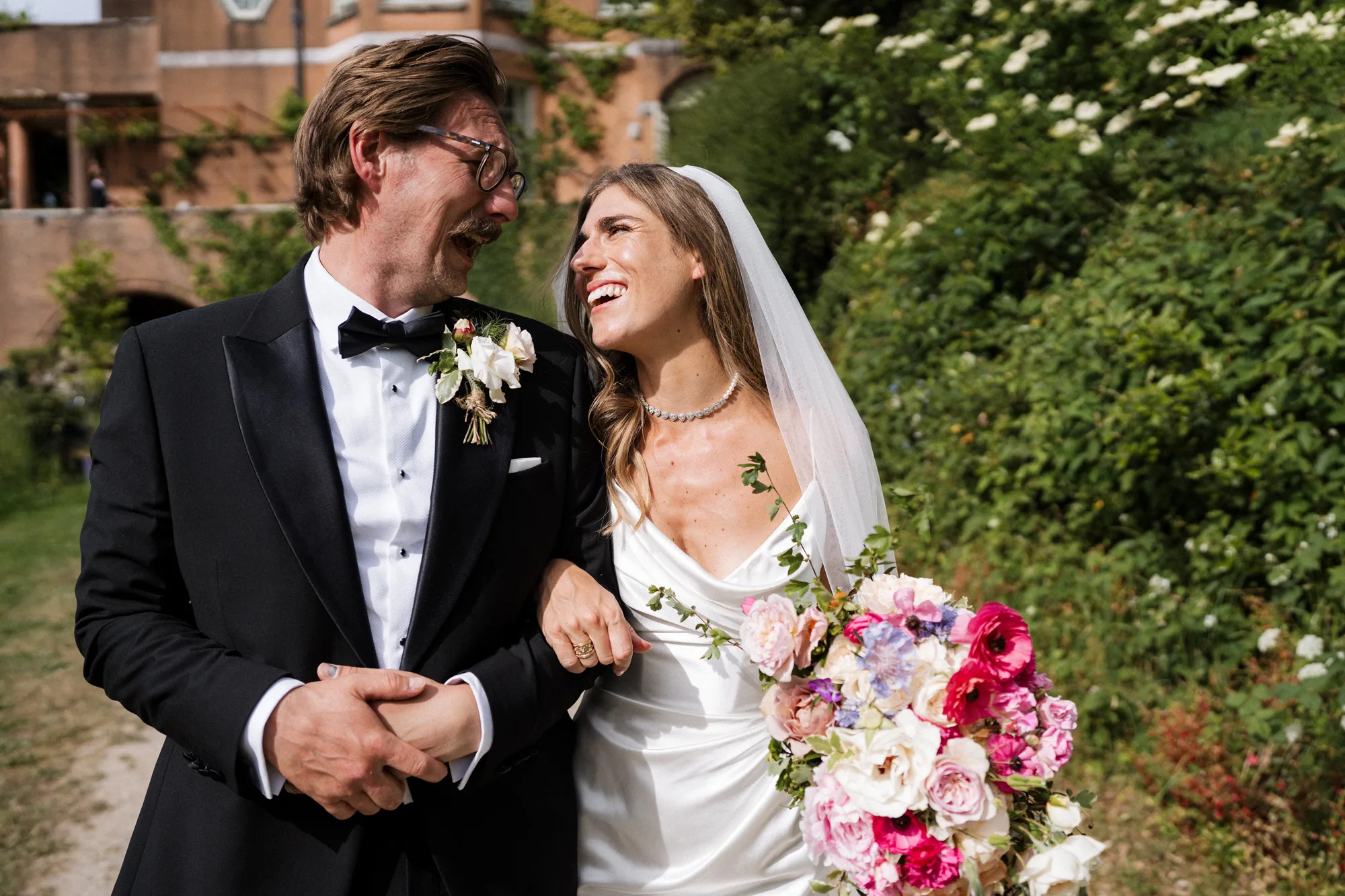 Lost Music Hall Wedding Devon Unique Home Stays Wedding Venue 138 - Lilly & Phil's Tim Walker Inspired Wedding at The Lost Music Hall in Devon Bride and groom walking arm in arm at The Lost Music Hall in Devon