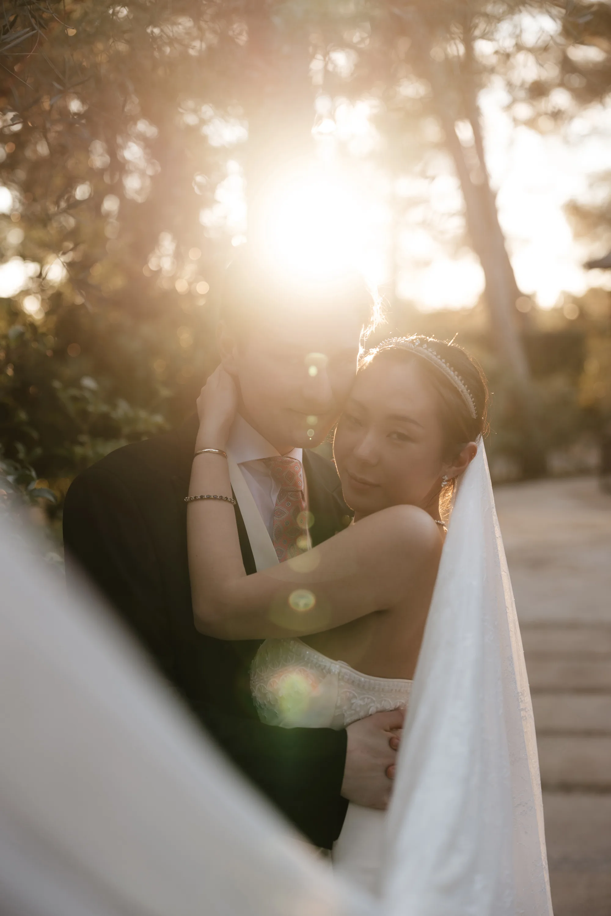 Wedding Toledo Spain Sam Sparks Photography 123 - A Multicultural Wedding in Toledo, Spain, with Korean Heritage and Deep Southern Roots Korean Bride and groom embracing in golden evening sunlight at their multicultural wedding in Toledo Spain.