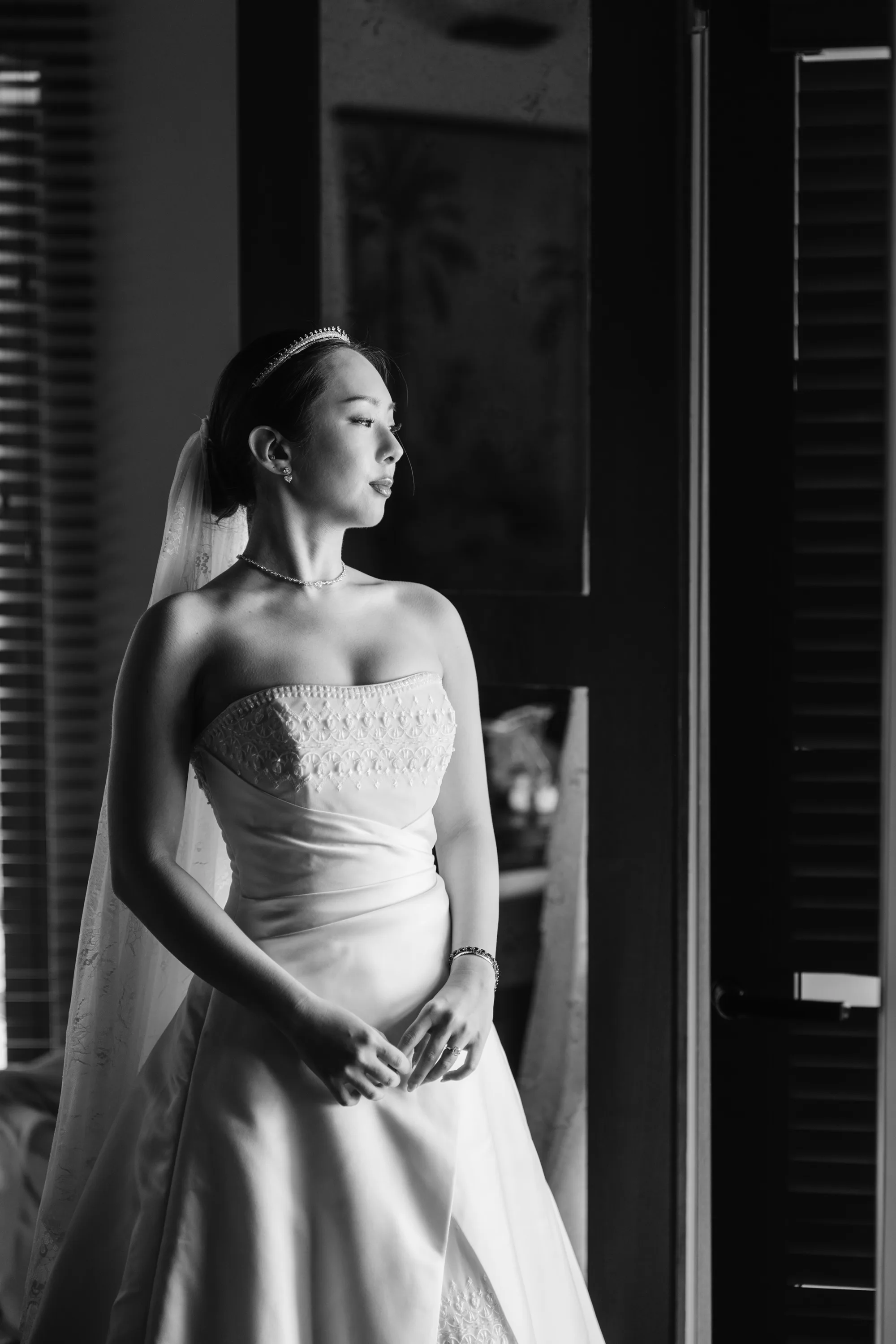 Wedding Toledo Spain Sam Sparks Photography 36 - A Multicultural Wedding in Toledo, Spain, with Korean Heritage and Deep Southern Roots Korean bride standing by natural window light, wearing Maggie Sottero