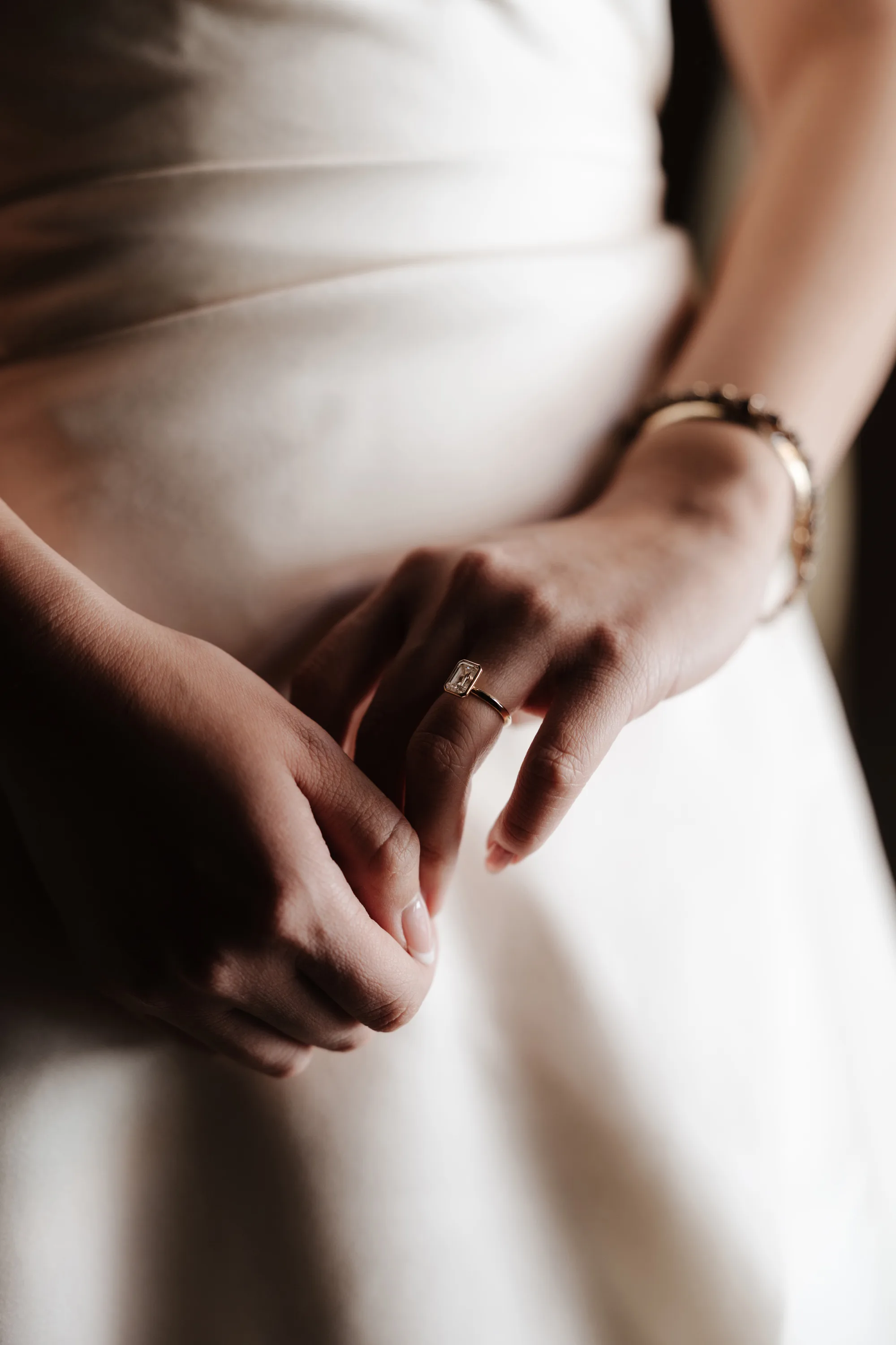 Wedding Toledo Spain Sam Sparks Photography 37 - A Multicultural Wedding in Toledo, Spain, with Korean Heritage and Deep Southern Roots Close up of bride's hands as she admires her diamond engagement ring.