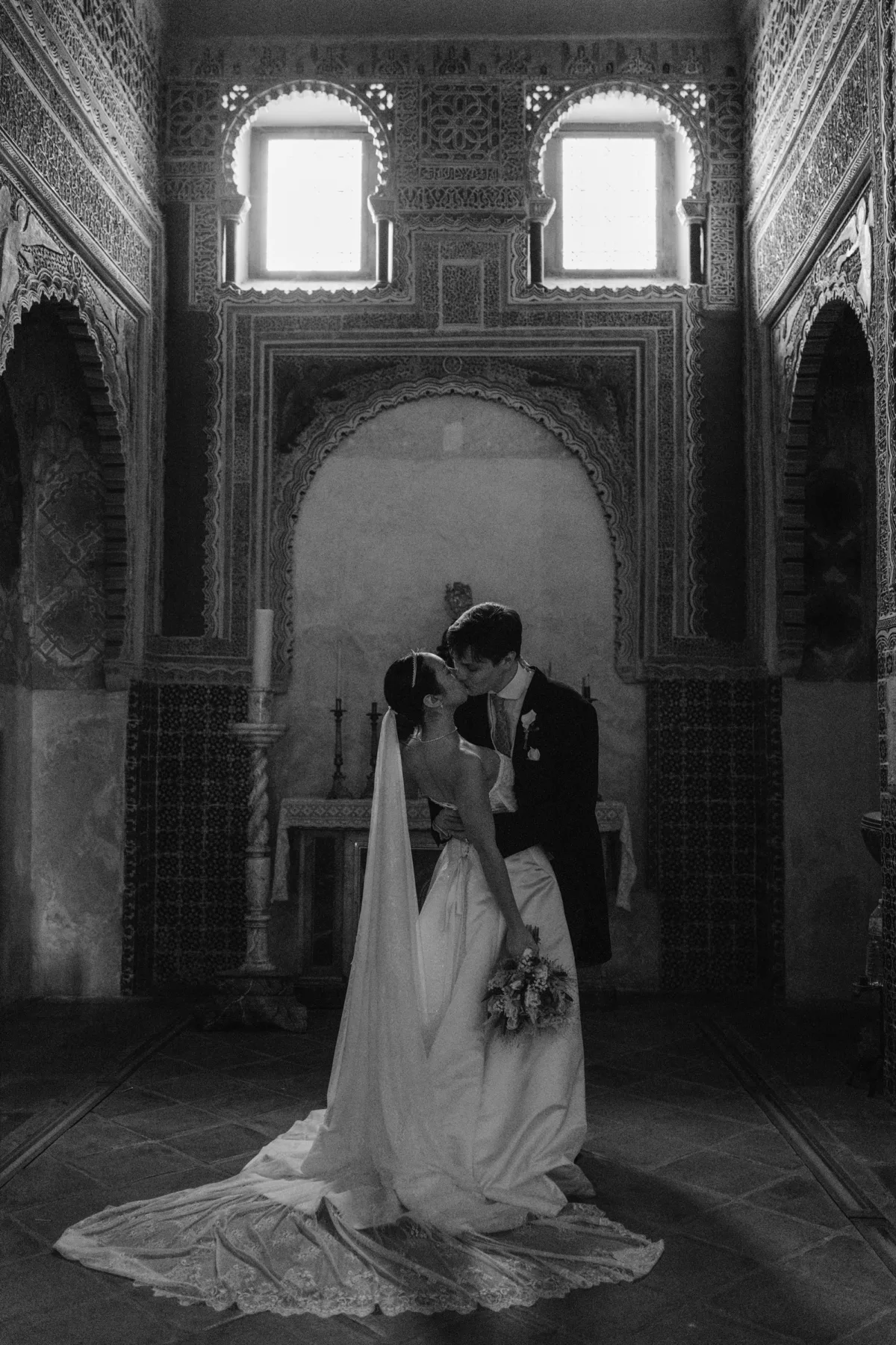 Wedding Toledo Spain Sam Sparks Photography 85 - A Multicultural Wedding in Toledo, Spain, with Korean Heritage and Deep Southern Roots Bride. andgroom kissing after their Catholic wedding ceremony at the Santos Justo y Pastor church in Toledo, Spain.